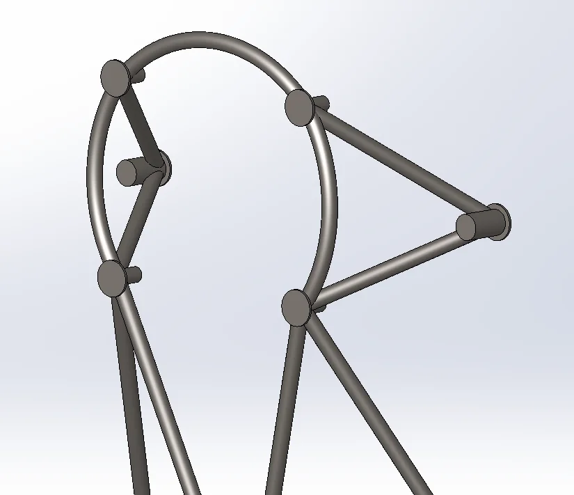 Welded engine mount ring showing coped tube intersections at each joint.