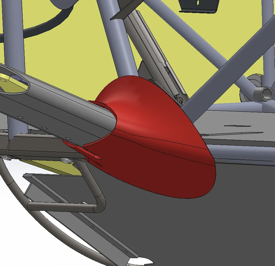 Aerodynamic speed fairing modeled on a landing-gear leg, shown installed within the surrounding airframe.